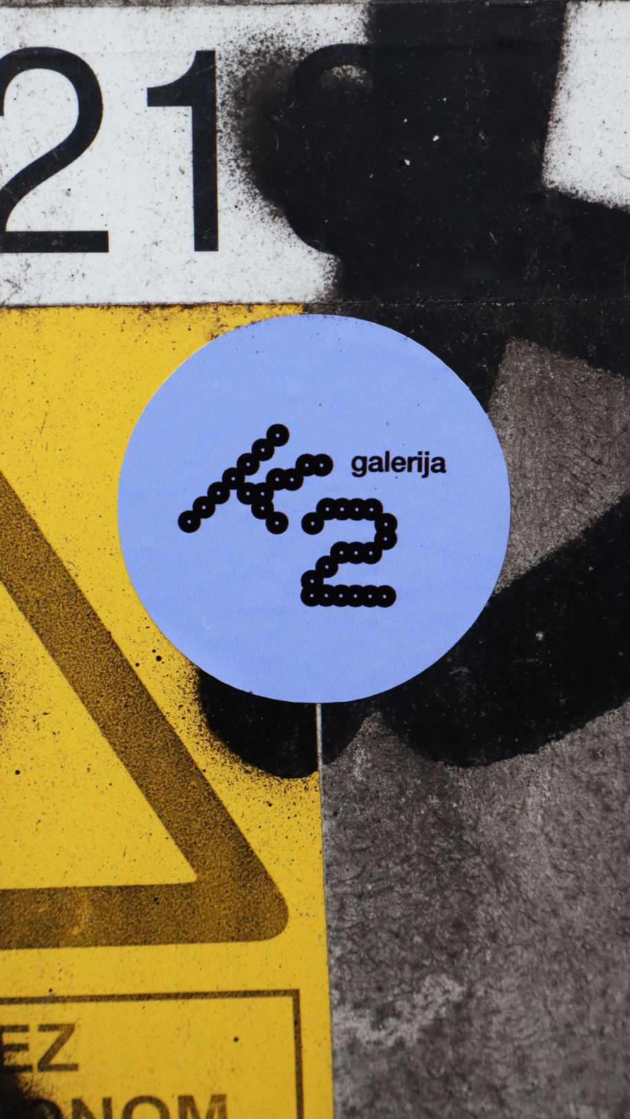 Gallery K2 visual identity displayed on a textured surface