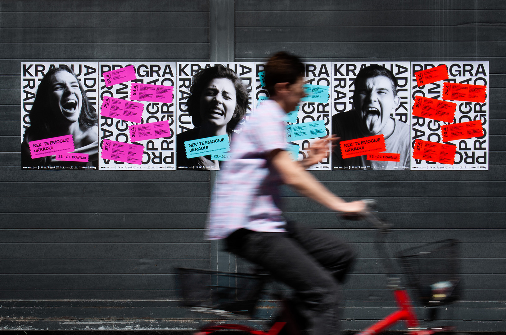 Colorful KRADU14 festival posters displayed in a public space