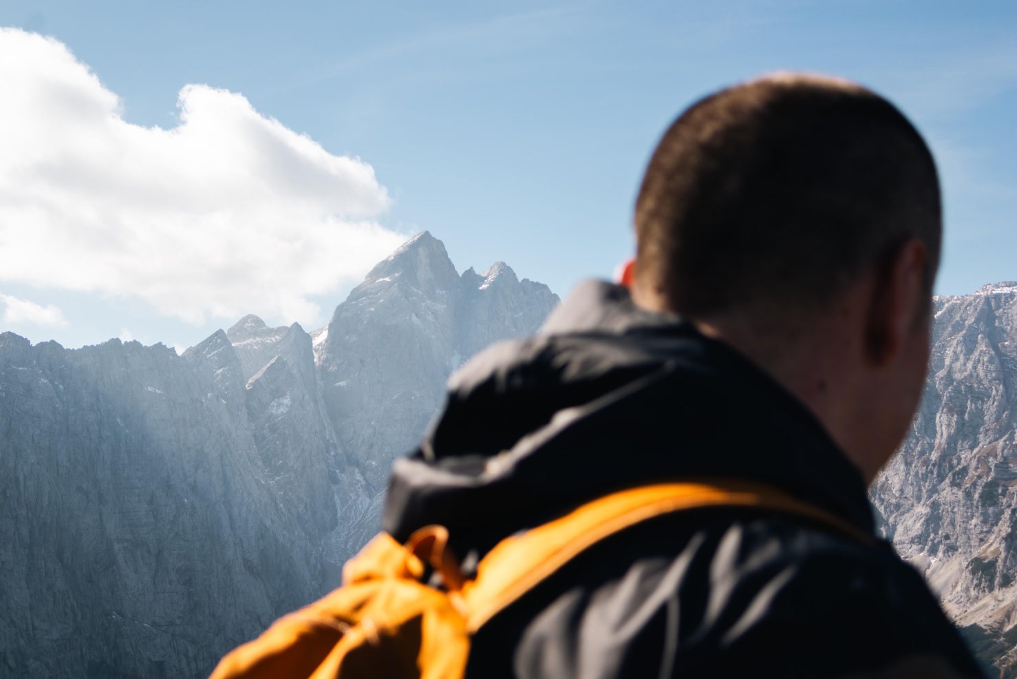 A hiker looking toward a mountain range