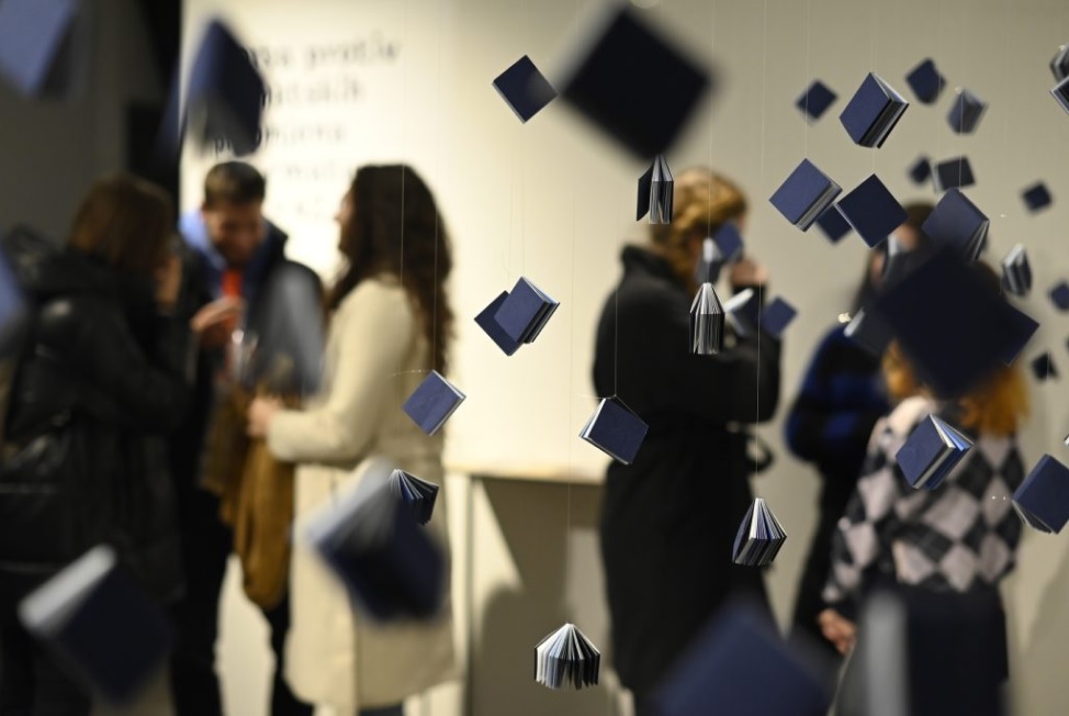 Visitors viewing an exhibition about plastic waste in the sea