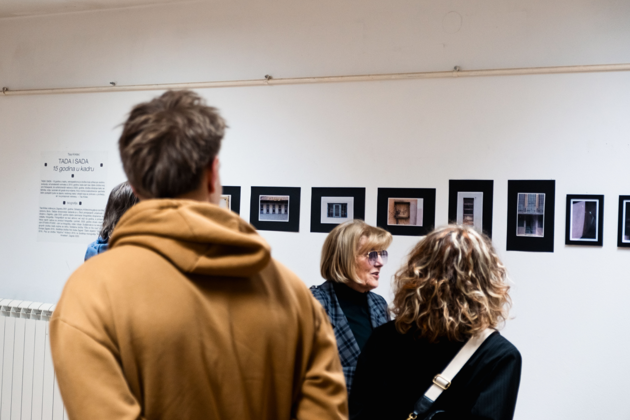 Visitors attending an exhibition opening at Gallery K2