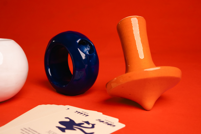 Blue, white, and orange ceramic game objects