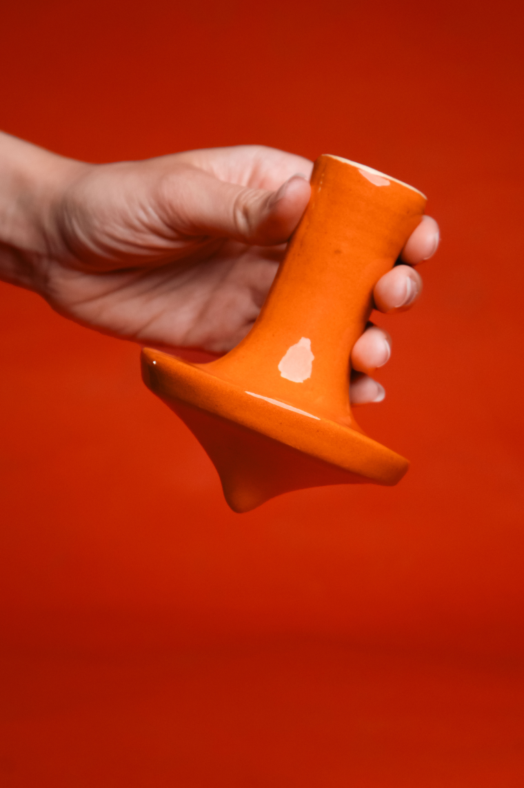 Orange ceramic game object held against an orange background