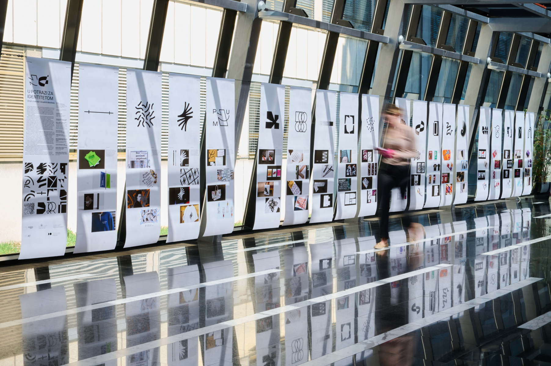 In Search of Identity exhibition panels installed in a large gallery corridor