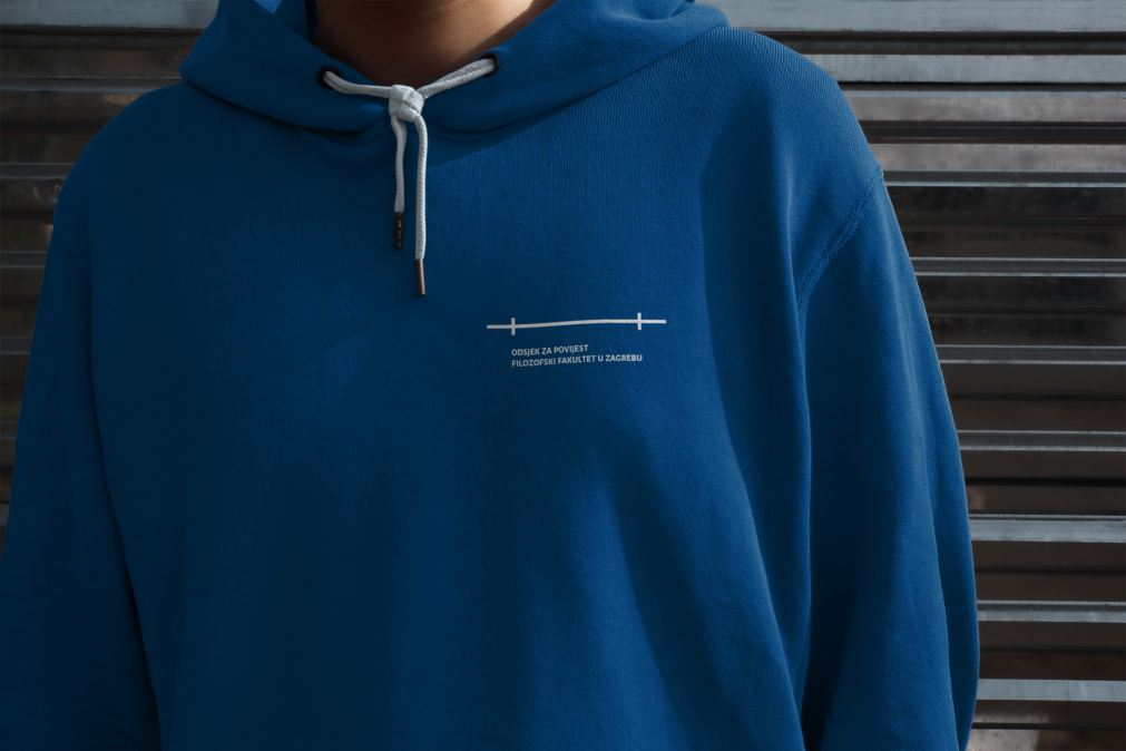 Visual identity symbol embroidered on a blue hoodie