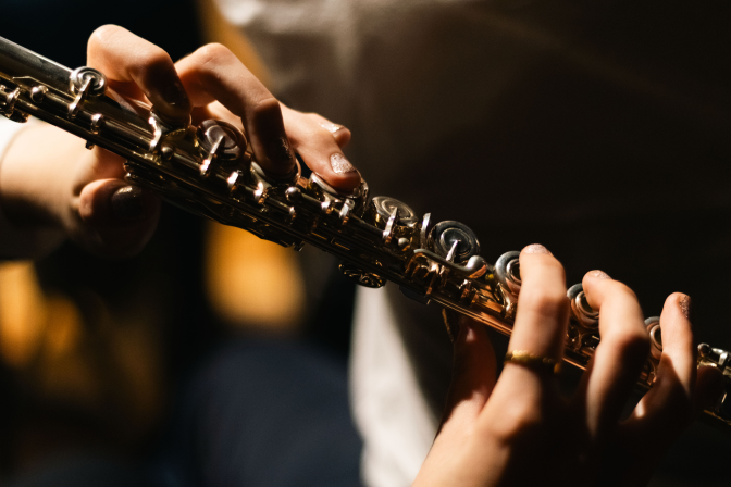 Close-up of a musician playing a woodwind instrument