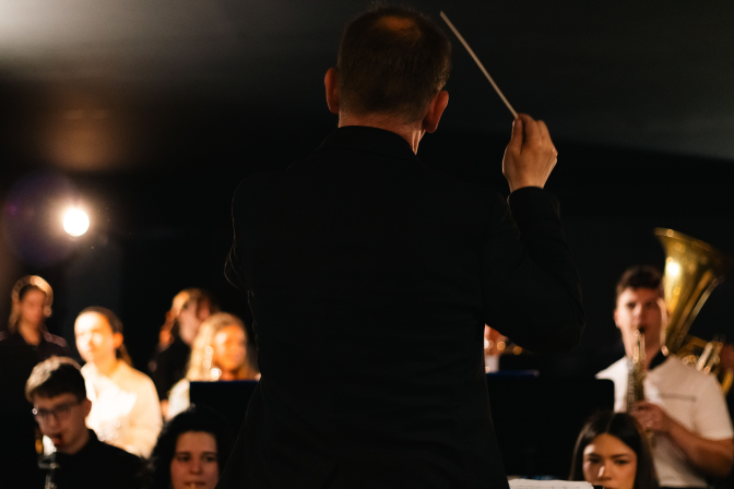 Musician performing in front of a festival audience