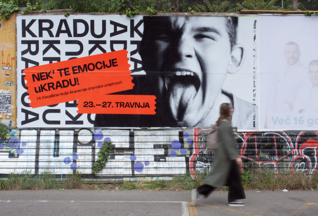 Large KRADU14 campaign billboard displayed in an urban setting