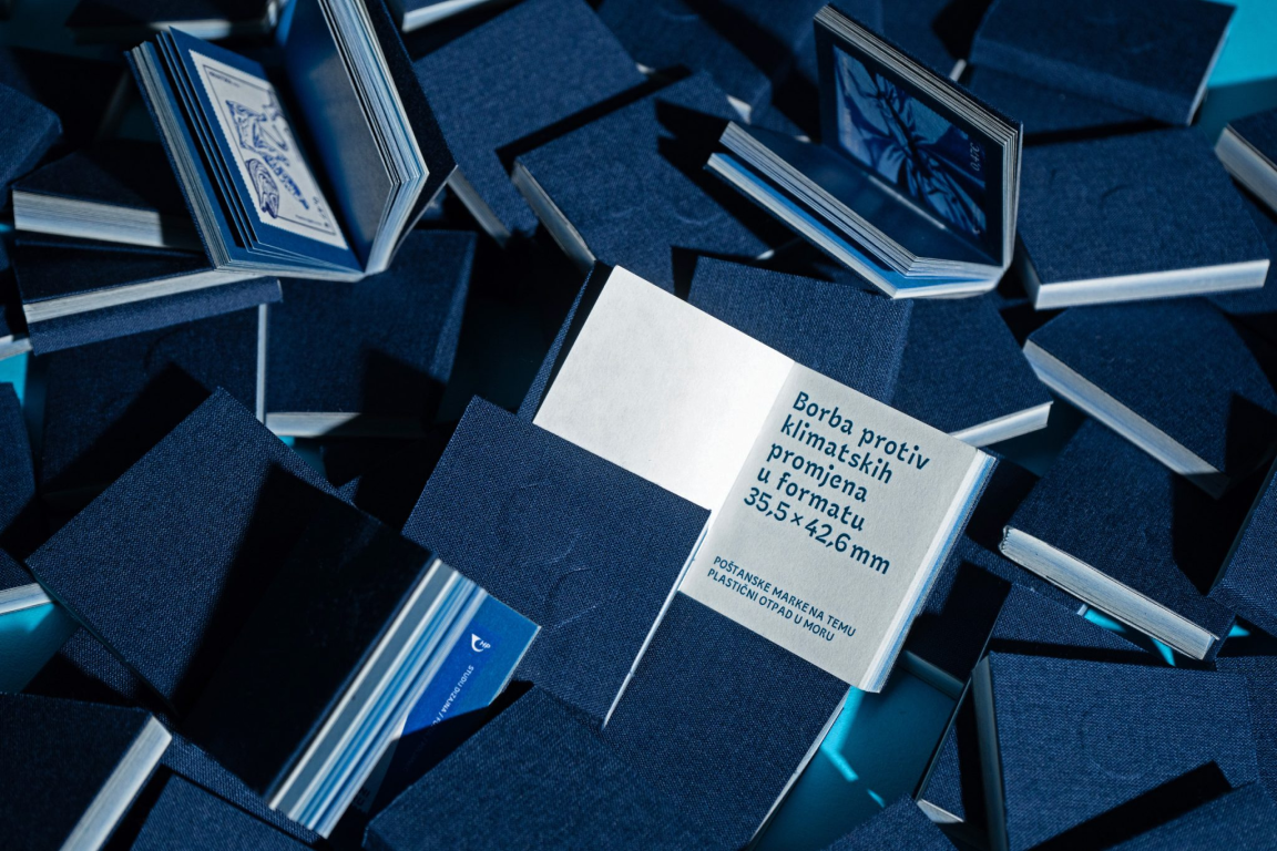 Blue commemorative stamp booklets arranged together