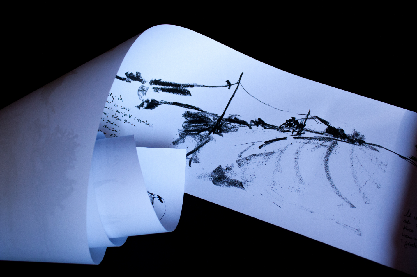 Long illustrated scroll unfolding in waves against a dark background