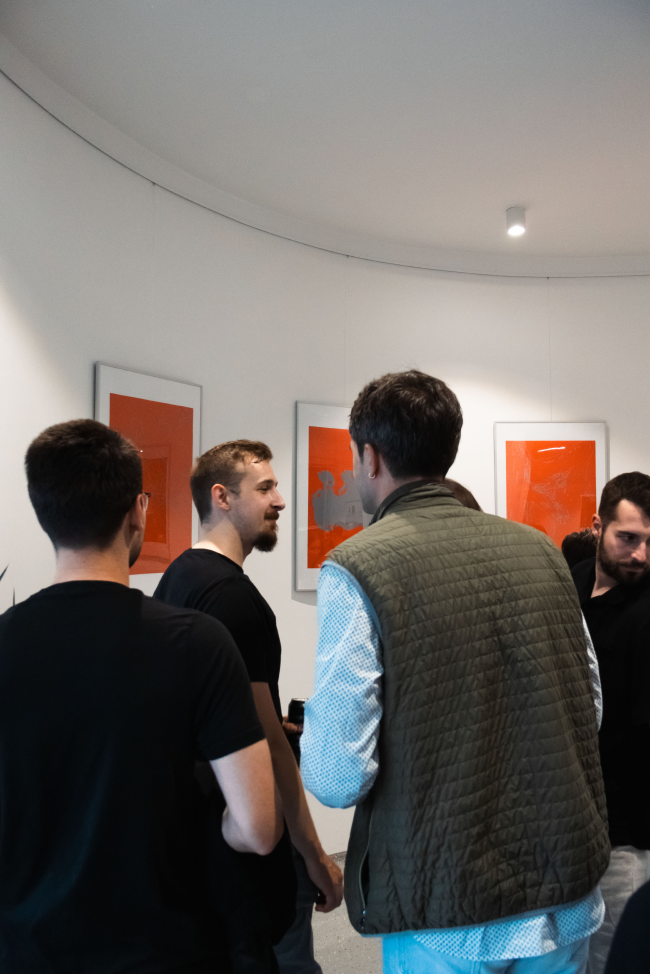 Visitors talking during the Varijacije exhibition opening